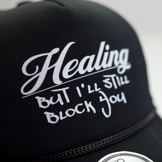 HEALING BLACK MESH TRUCKER HAT