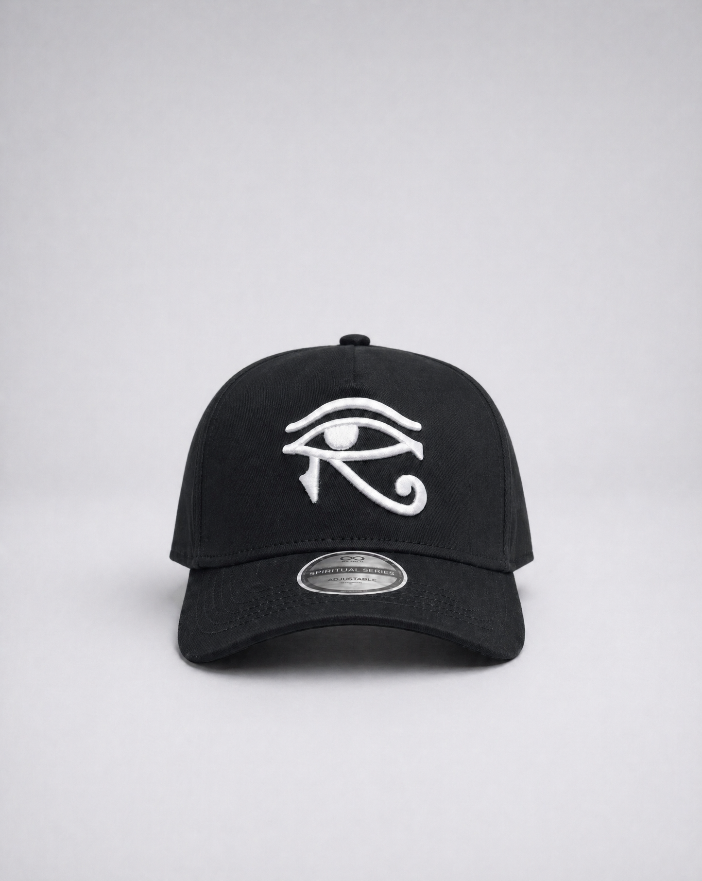 Black cap with white eye symbol on a gray background