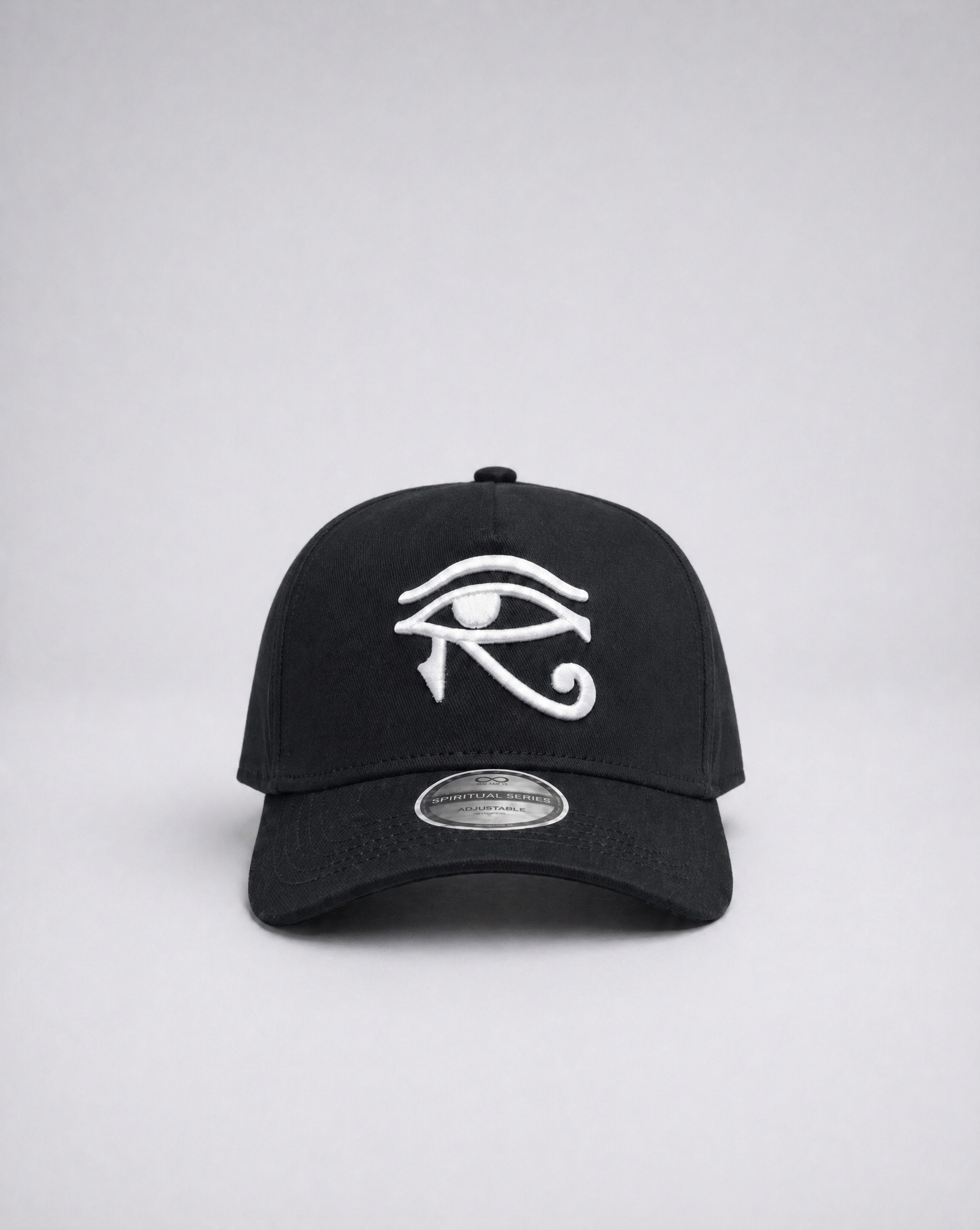 Black cap with white eye symbol on a gray background