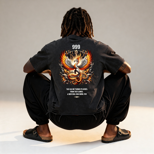 Person wearing a black jacket with a phoenix design on the back, sitting against a plain background.