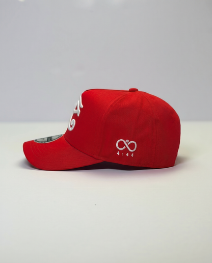 Red eyey of horus cap with a logo on a white background