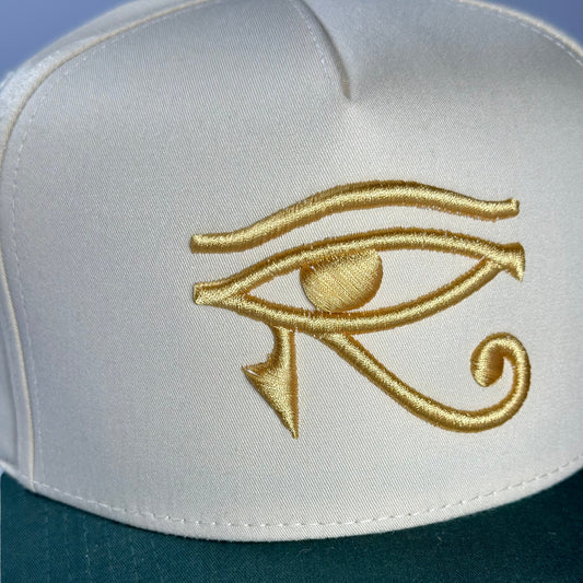 EYE OF HORUS GOLD TRUCKER HAT