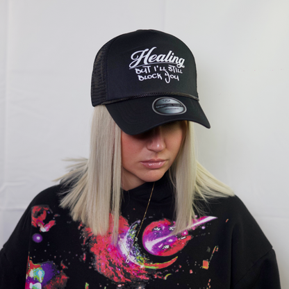HEALING BLACK MESH TRUCKER HAT