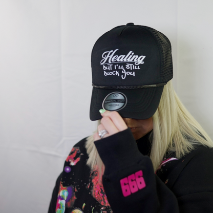 HEALING BLACK MESH TRUCKER HAT
