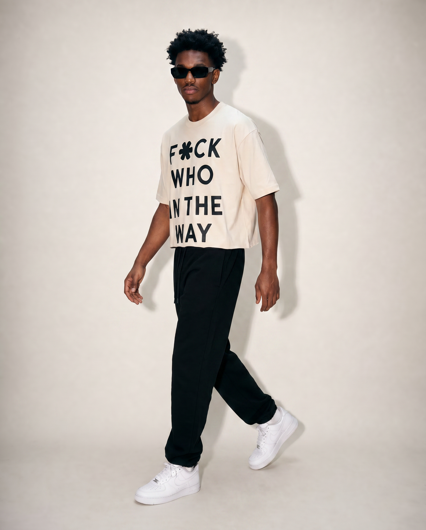 Front walk of man wearing off-white cropped ultra heavy cotton raw hem t-shirt. 