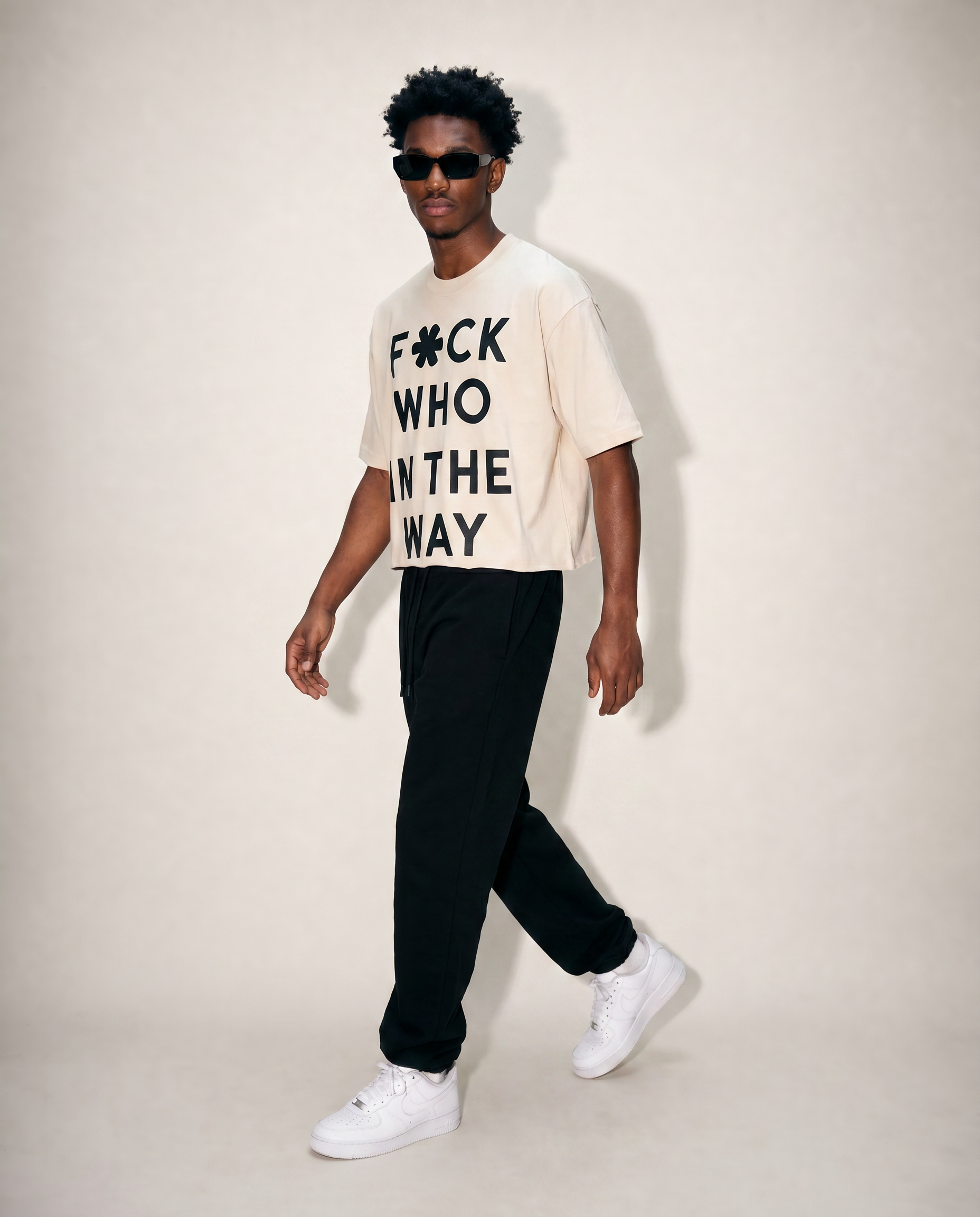 Front walk of man wearing off-white cropped ultra heavy cotton raw hem t-shirt. 