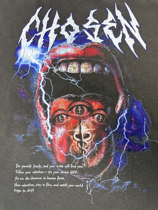 T-shirt with a graphic design of a face wearing a helmet, surrounded by lightning and the word 'Chosen'.