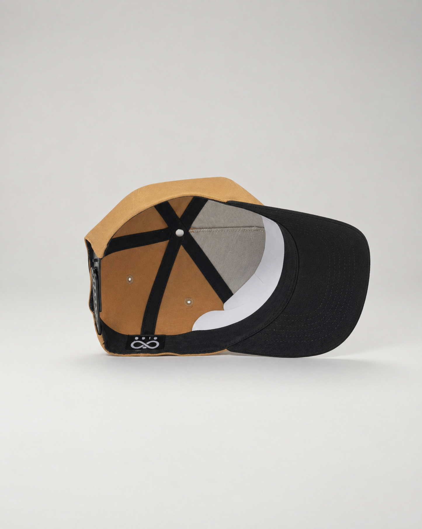 Multicolored cap with geometric pattern on a light gray background