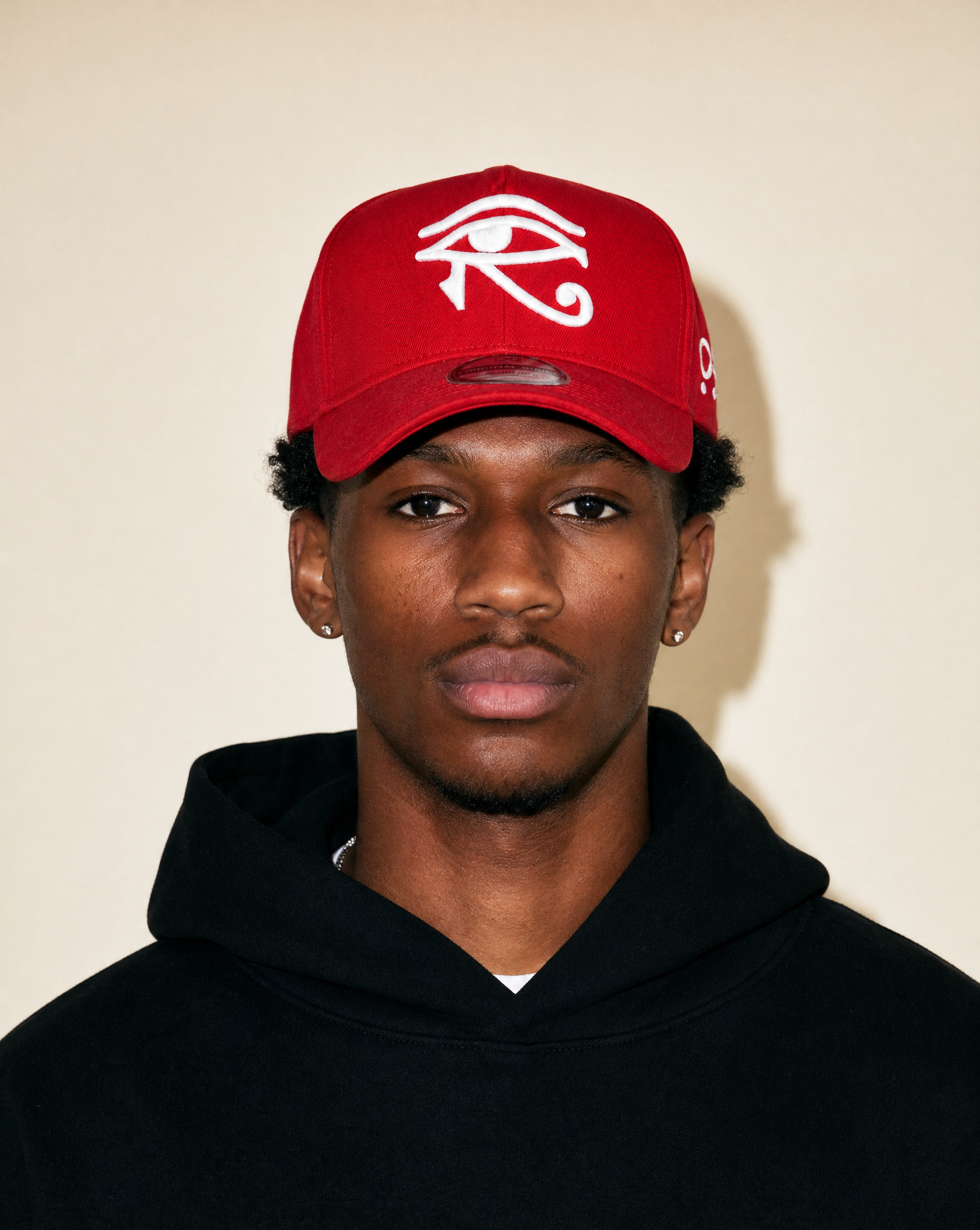 Red cap eye of horus with white eye symbol on a light white background