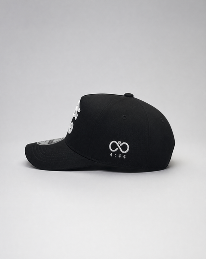Black cap with white logo on a light gray background
